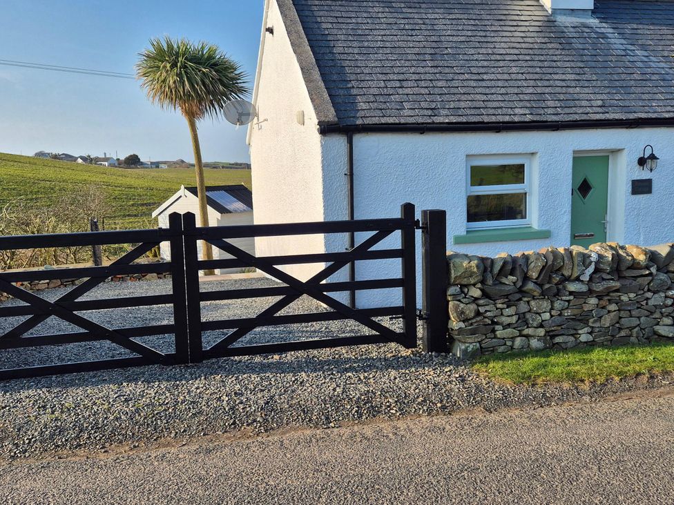 A house with a gate and stone wall at Beautiful 2Bed semi rural cottage enclosed garden Stranraer
