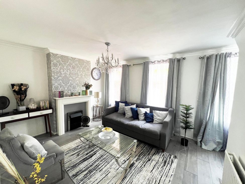 A living room with a sofa and coffee table at Suspire House Sleeps 6 Garden Bbq Coastal retreat Near Valley