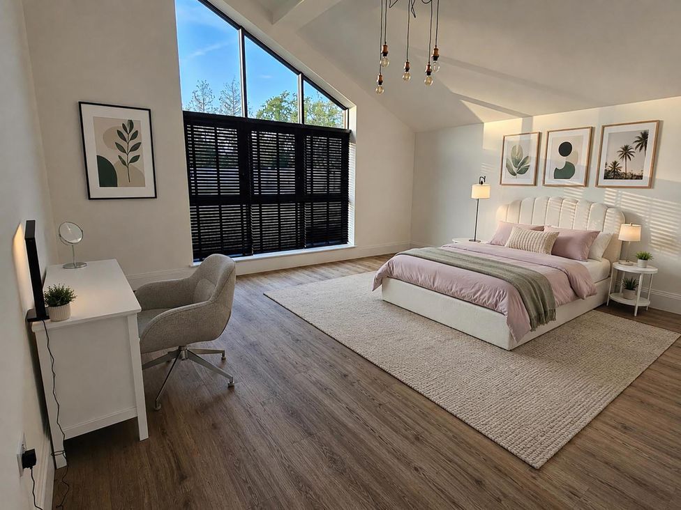 A bedroom with a bed and desk at Luxury Kent Bungalow Retreat Sleeps 12 Cross-at-Hand near Staplehurst