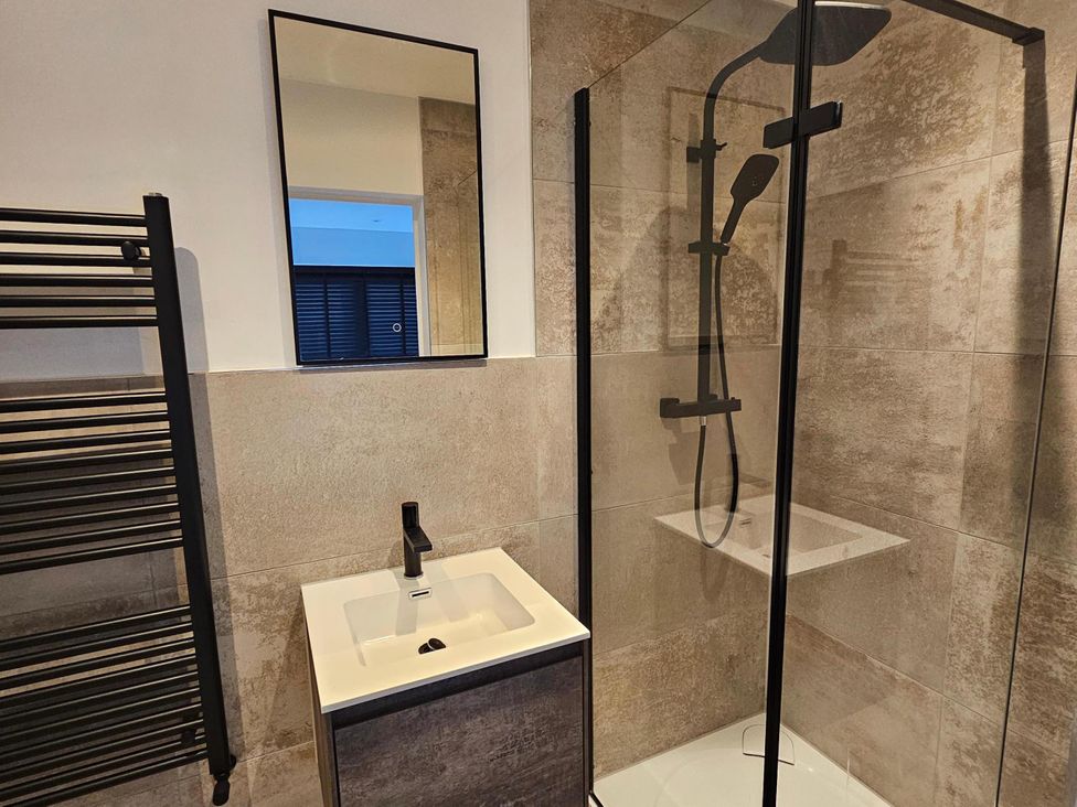 A bathroom with a shower and sink at Luxury Kent Bungalow Retreat Sleeps 12 Cross-at-Hand near Staplehurst