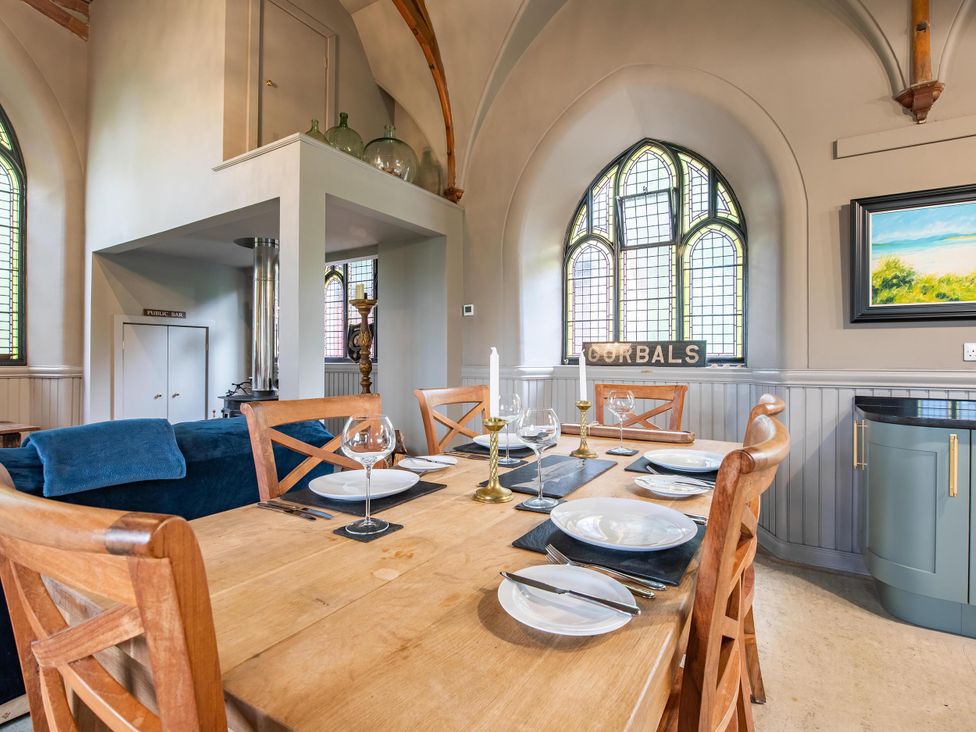 A dining room with a table set for dinner at Grade C Church in Cannich