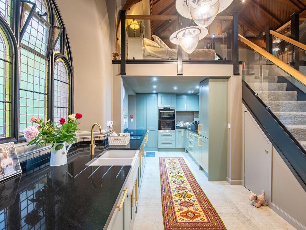 A kitchen with cabinets and a sink at Grade C Church in Cannich