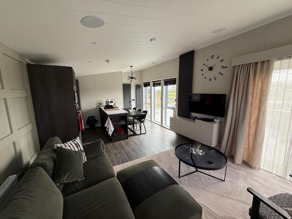 A living room with a sofa and dining area at Malton 2Bed Lodge Sleeps 4 Pet Friendly, Malton
