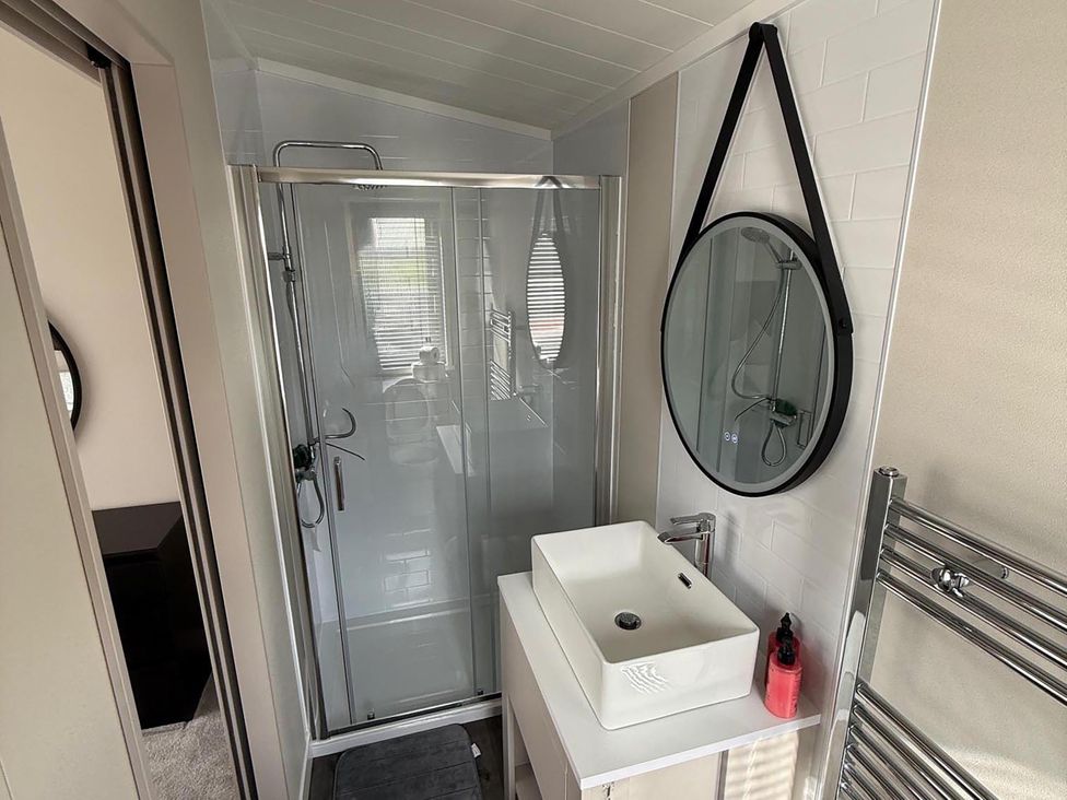 A bathroom with a shower and sink at Malton 2Bed Lodge Sleeps 4 Pet Friendly, Malton