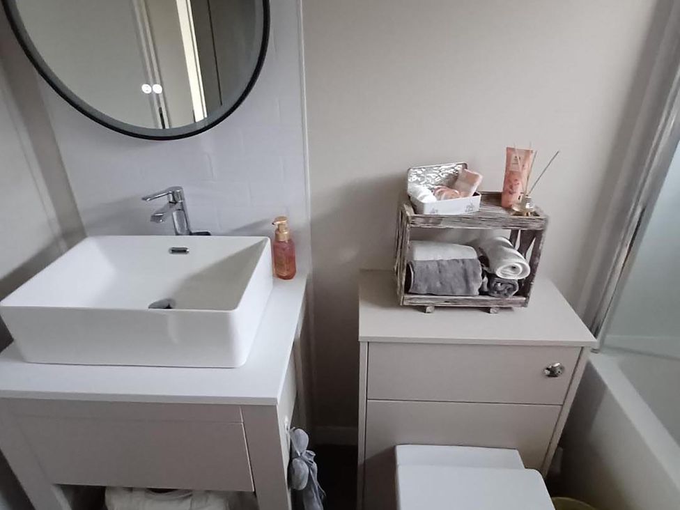 A bathroom with a sink and storage container at Malton 2Bed Lodge Sleeps 4 Pet Friendly, Malton