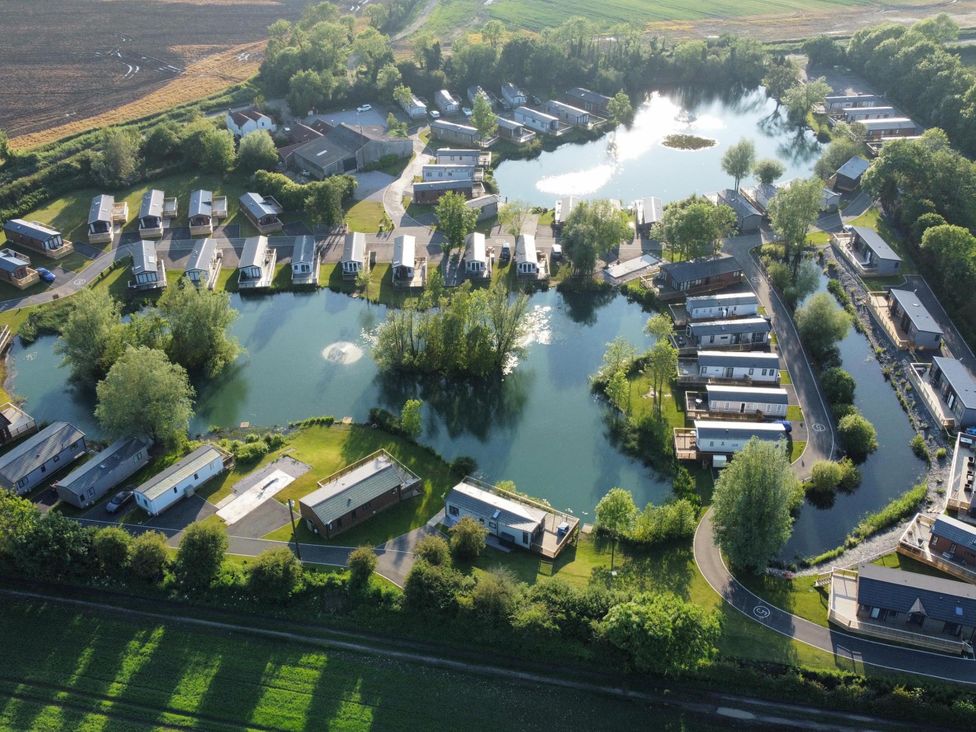 A view of lodges around a lake at Malton 2Bed Lodge Sleeps 4 Pet Friendly in Malton