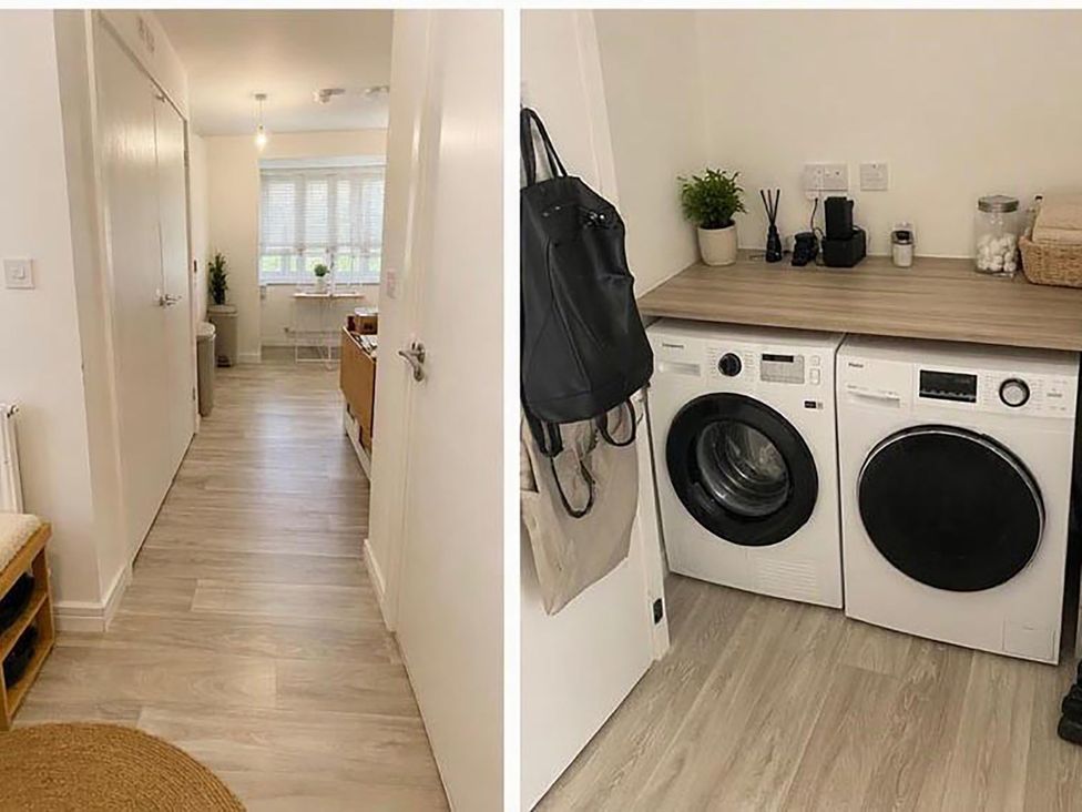 A laundry room with a washer and dryer at the property in the location