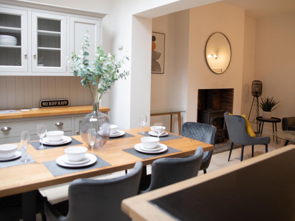 A dining room with a table and chairs at York Minster 3bed Sleeps 6 Fireplace Free Parking, York