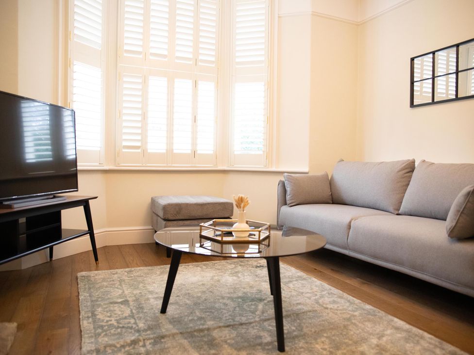 A living room with a sofa and coffee table at York Minster 3bed Sleeps 6 Fireplace Free Parking in York