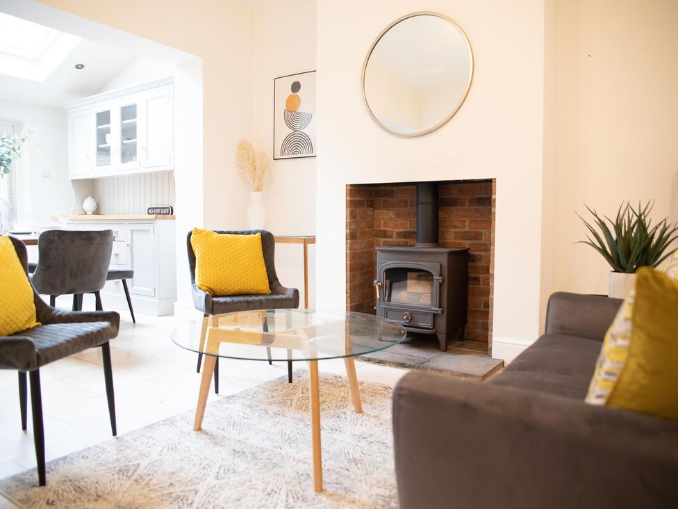 A living room with a coffee table and wood stove at York Minster 3bed Sleeps 6 Fireplace Free Parking in York