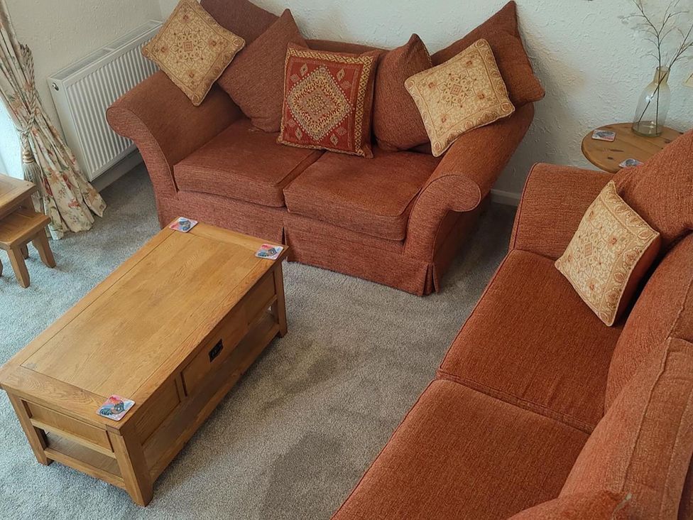 A living room with a sofa and coffee table at Split Level Bungalow Sleeps4 Close to walks Stanton Hill