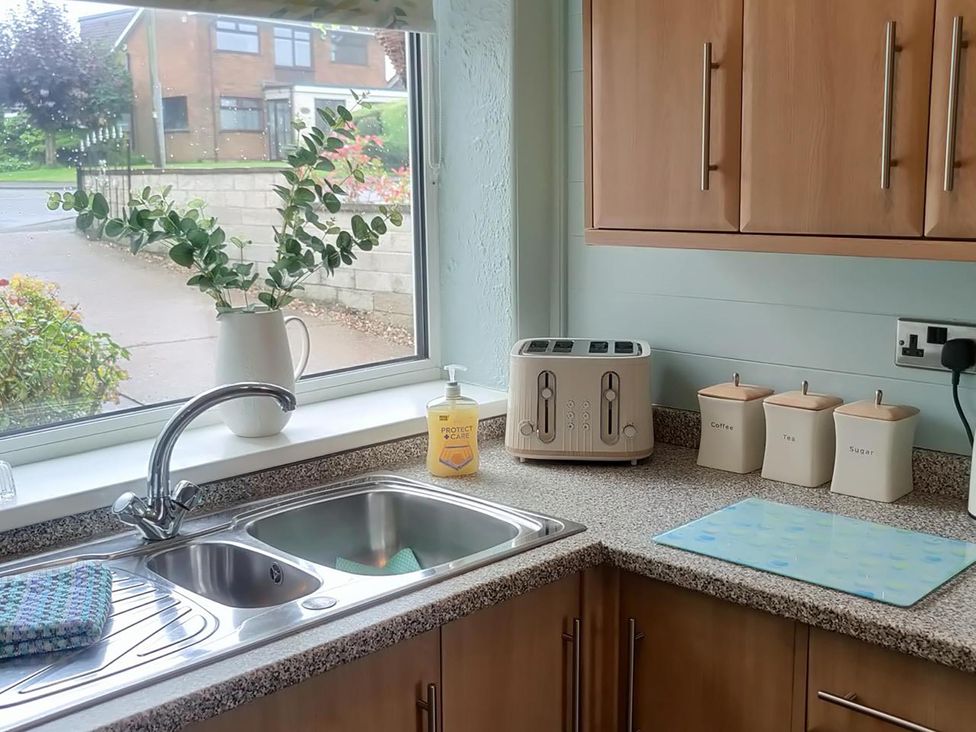 A kitchen with a sink and toaster at Split Level Bungalow Sleeps4 Close to walks Stanton Hill