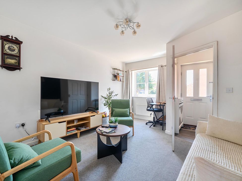 A living room with a sofa, coffee table and television at House Sleeps 6 Enclosed Garden Pet Friendly Bridgwater