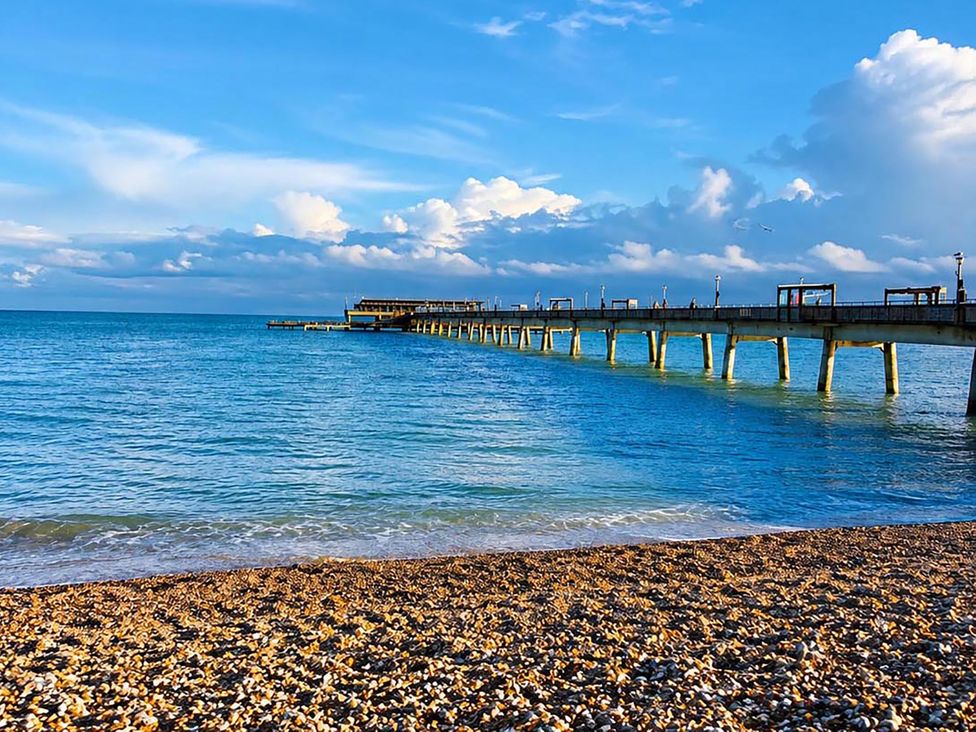 A pier extending over a body of water at Coastal Chalet Retreat in St Margaret's Bay
