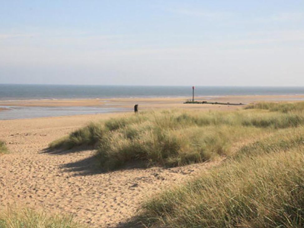 A beach with sand dunes and ocean view at Sandy Paws Dog Friendly Anderby Creek