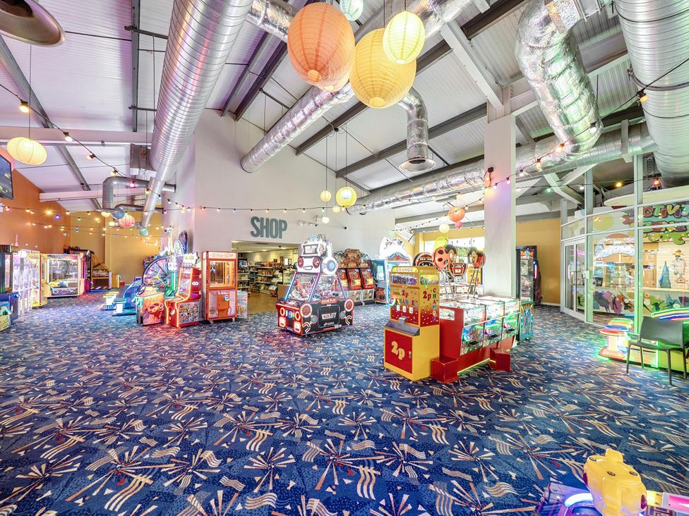 An arcade filled with various game machines at 3 Bed Caravan Sleeps 8 Pets Garden Parking Hull