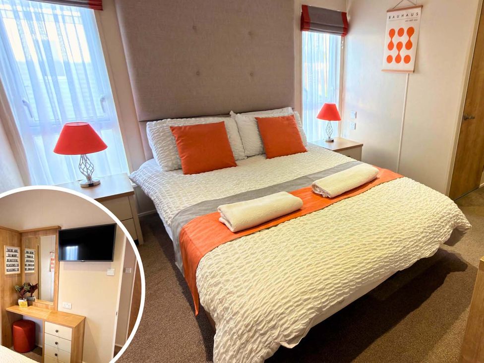 A bedroom with a bed and bedside lamp at The Old Barn in Manchester