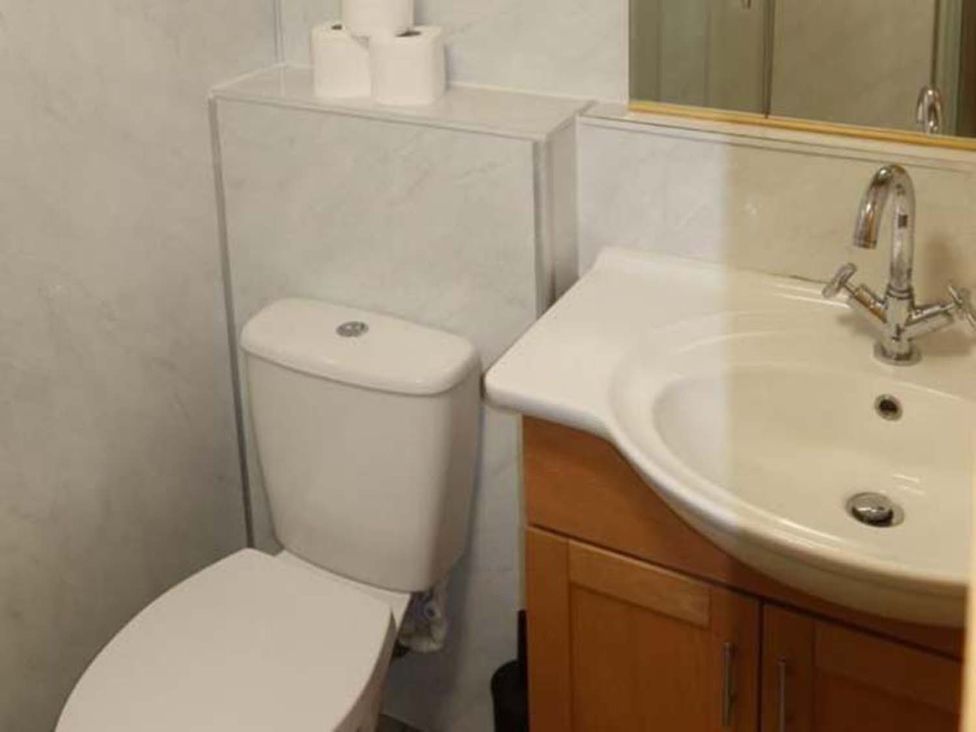 A bathroom with a sink and toilet at The Old Barn in Manchester