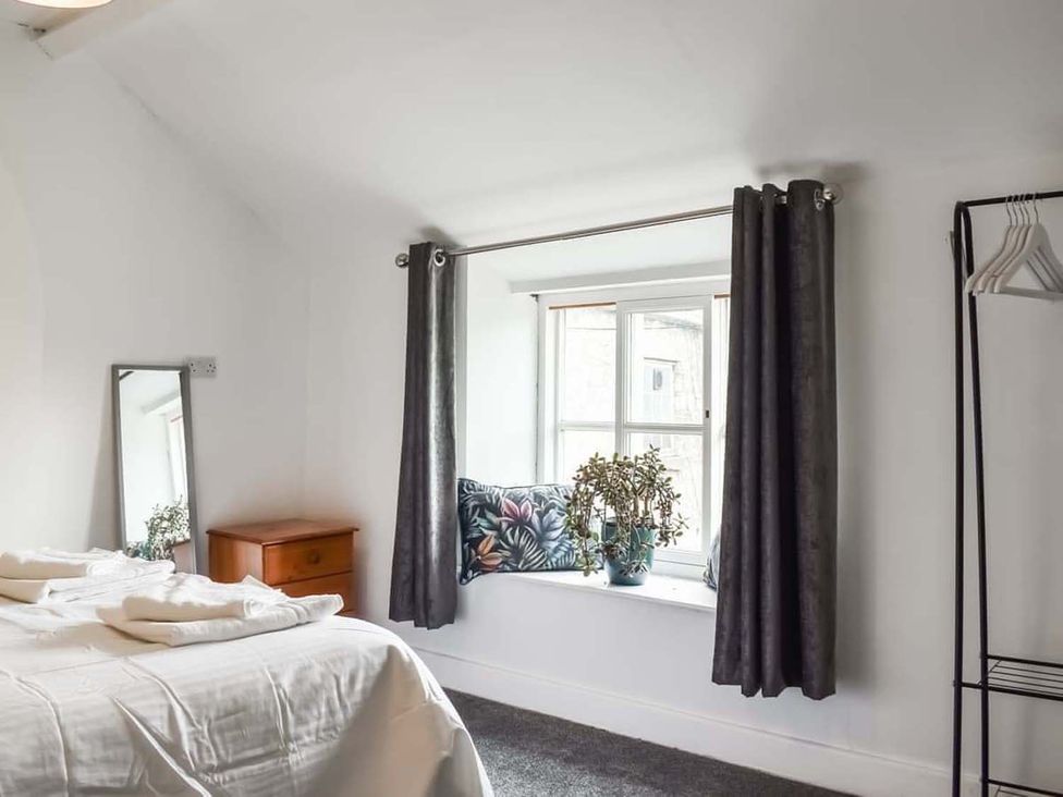 A bedroom with a bed and a window at 