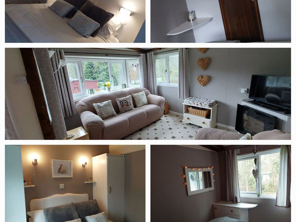 A living room with a sofa and television at The Old Barn in Builth Wells