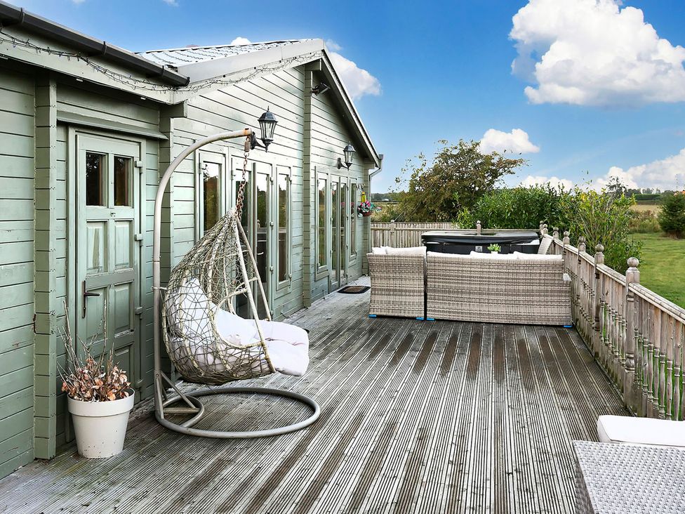 An outdoor space with a hanging chair and sofa at the property in unspecified location