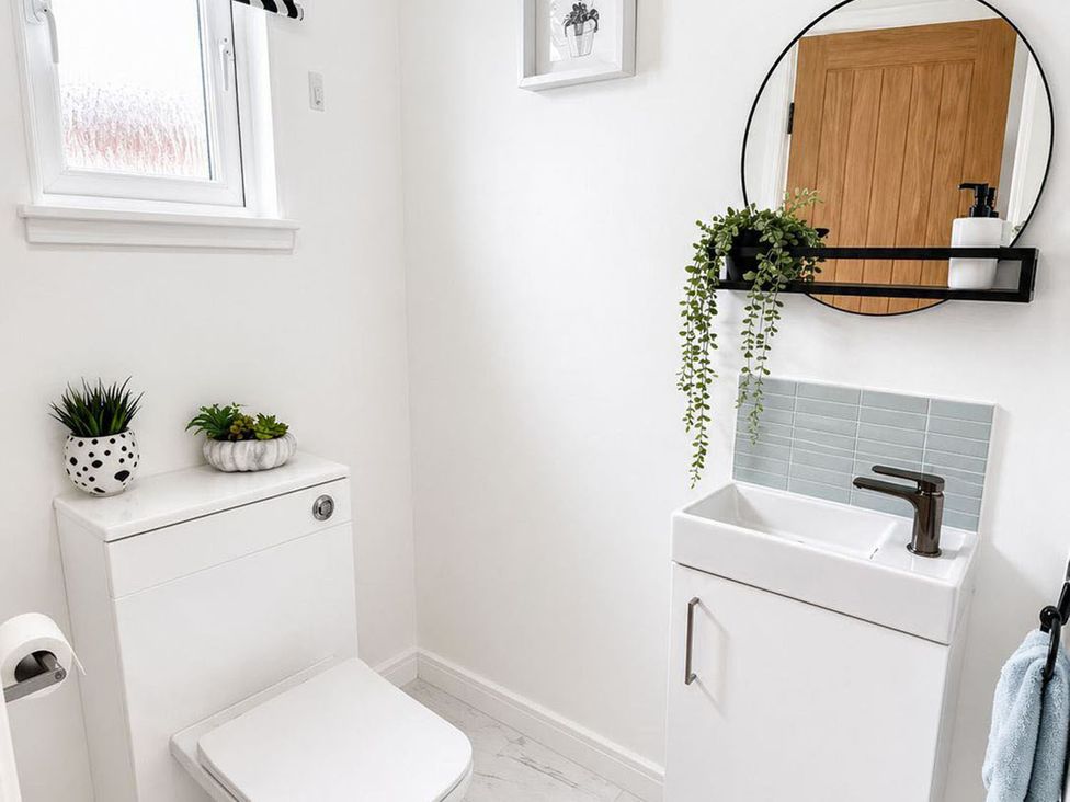 A bathroom with a toilet and sink at 