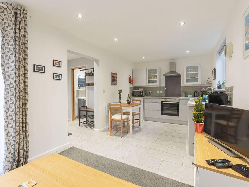 A kitchen with a table and chairs at 1Bed Coastal Retreat Sleeps 2 Parking Wifi in Bude