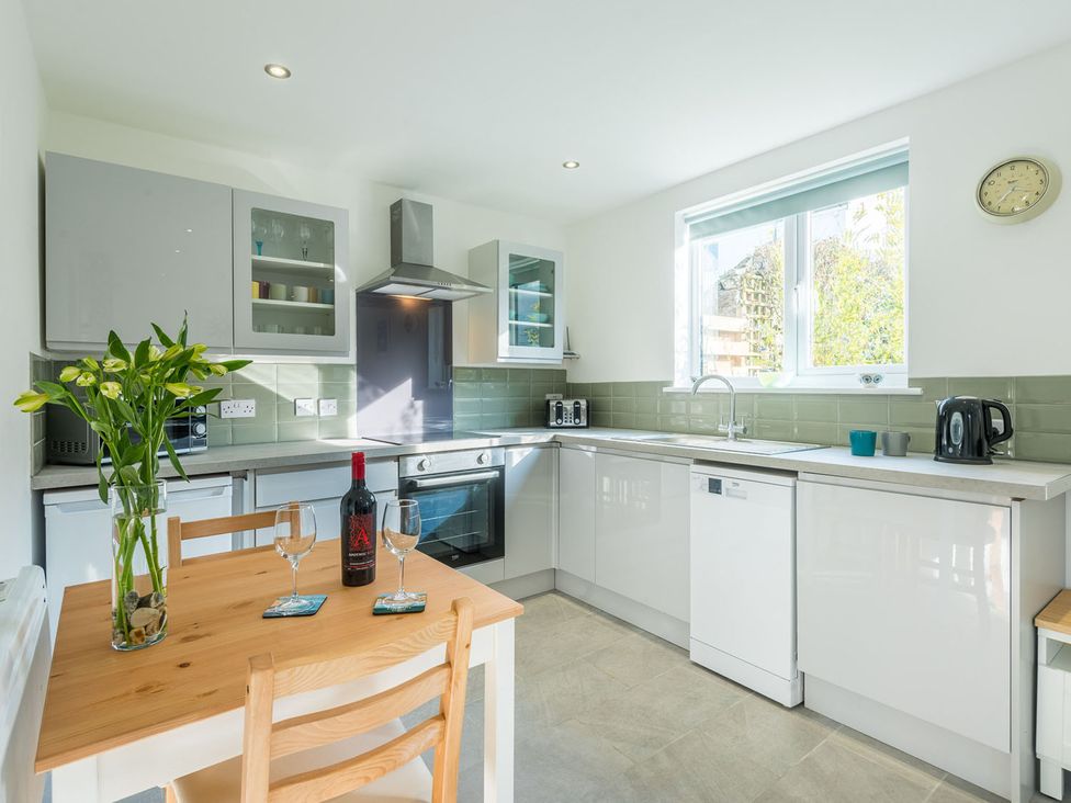 A kitchen with a table and chairs at 1Bed Coastal Retreat Sleeps 2 Parking Wifi in Bude