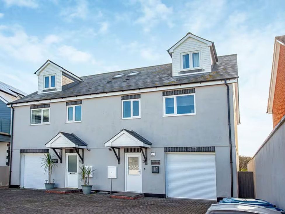 A house with two stories and multiple windows at Spacious 3 Bed House Sleeps 6 Parking Wifi Newquay