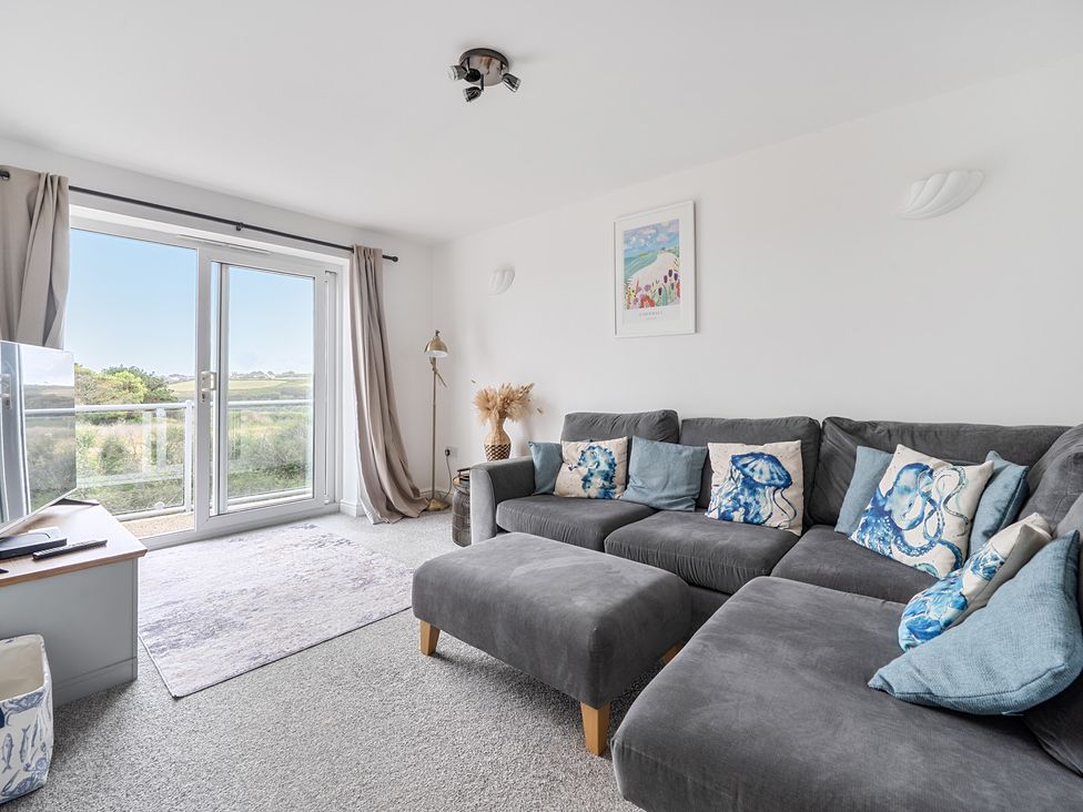 A living room with a sofa and television at Spacious 3 Bed House Sleeps 6 Parking Wifi Newquay