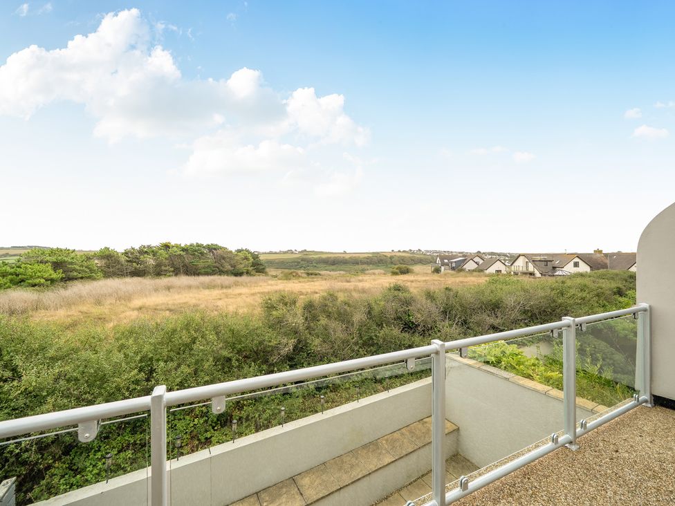 A balcony with a view of the landscape at Spacious 3 Bed House Sleeps 6 Parking Wifi in Newquay