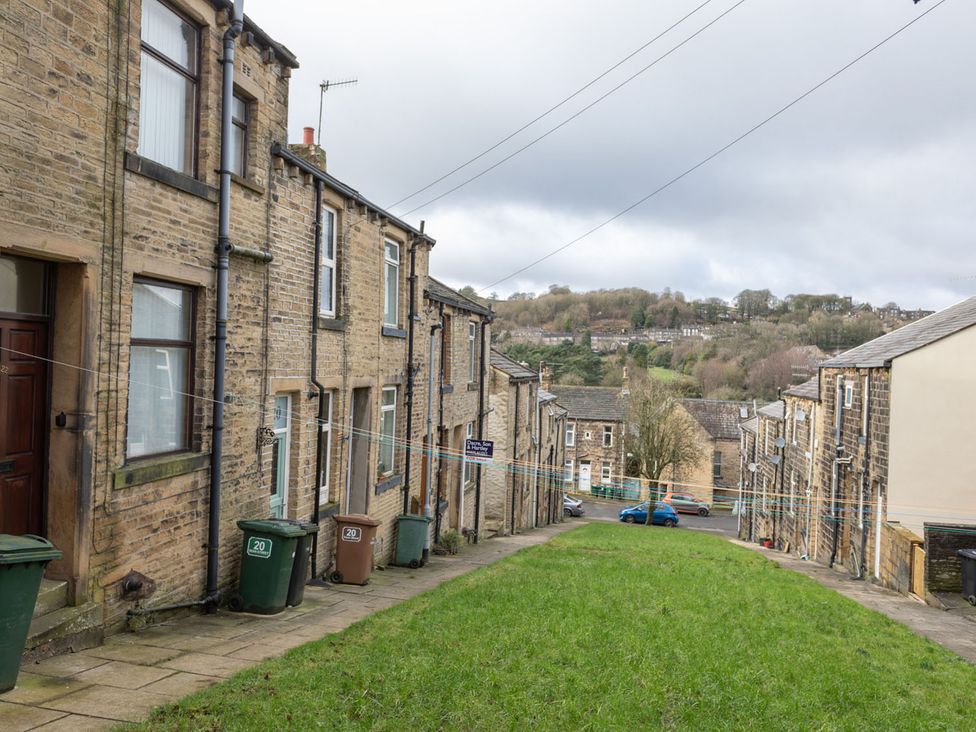 A view of residential buildings and grass area at Haworth Village House Sleeps 6 Parking Pets in Cross Roads
