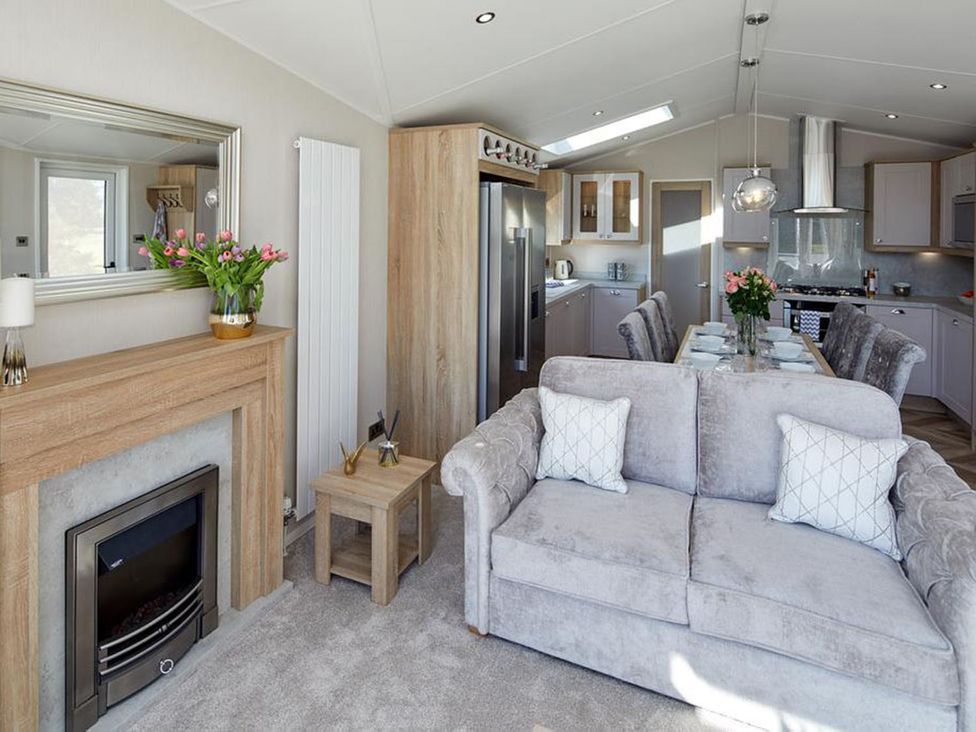 A living room with modern furniture at 2Br Lodge Pool Fireplace PetsOK Parking in Goonhavern
