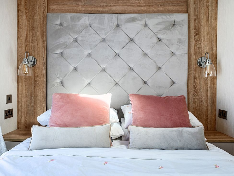 A bedroom with a bed and pillows at 2Br Lodge Pool Fireplace PetsOK Parking Goonhavern
