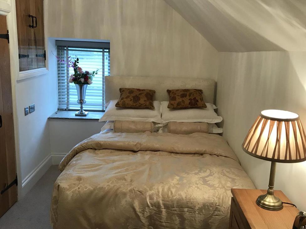 A bedroom with a bed and window at Barn Sleeps 4 Parking Near Alton Towers, Waterhouses