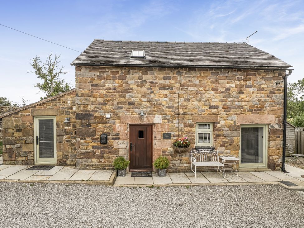 The exterior of a stone cottage with a front door and windows at Barn Sleeps 4 Parking Near Alton Towers Waterhouses