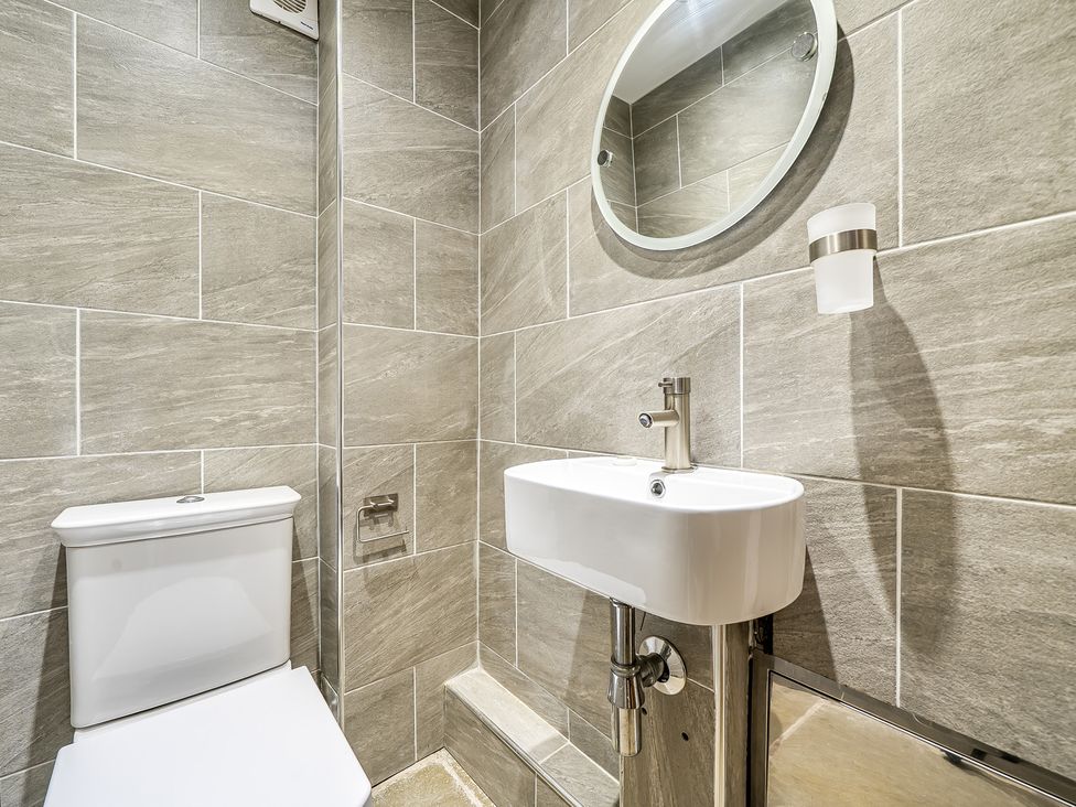 A bathroom with a toilet and sink at Barn Sleeps 4 Parking Near Alton Towers in Waterhouses