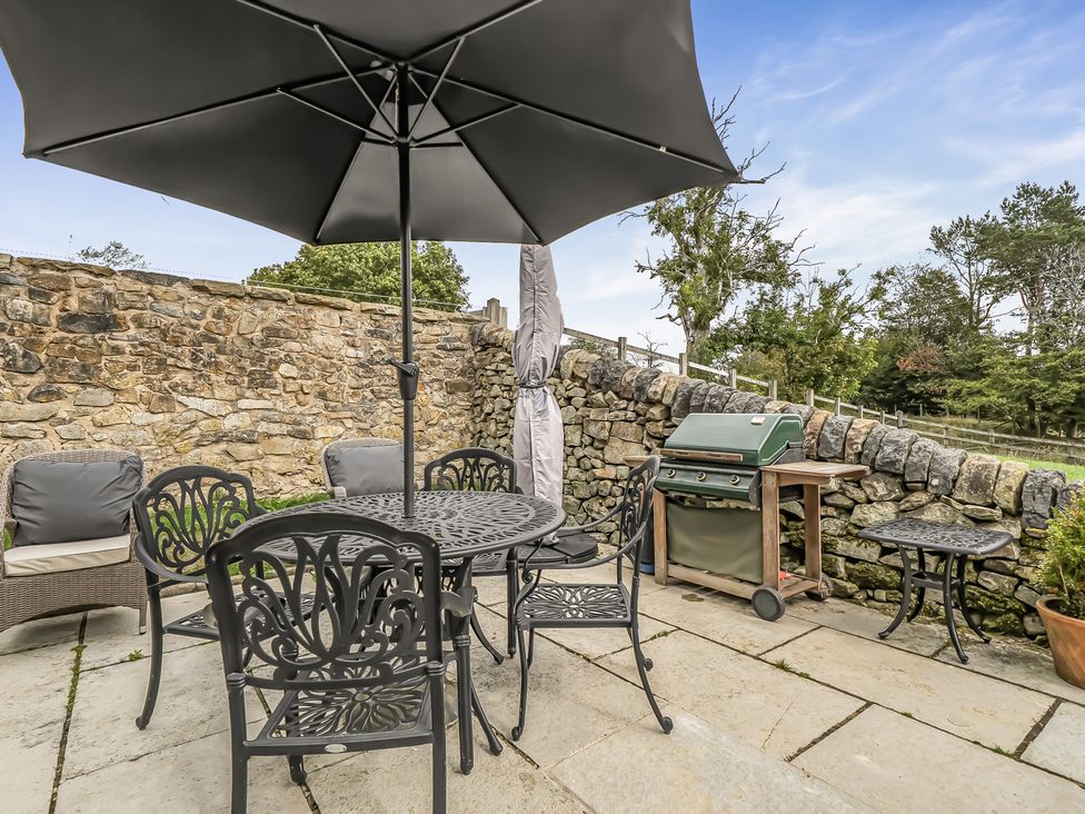 An outdoor terrace with a table and chairs at Barn Sleeps 4 Parking Near Alton Towers Waterhouses