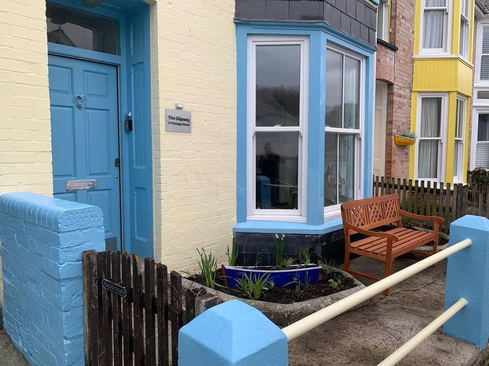 The entrance to a property with a door and bench at The Slipway Fowey Harbour with Garden Fowey