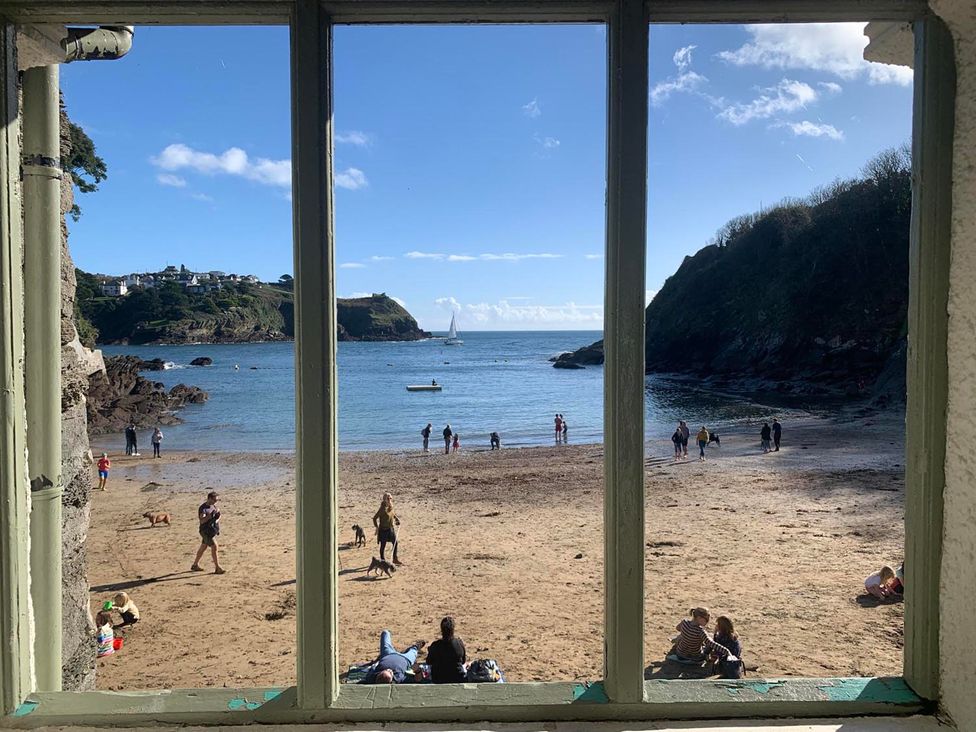 A beach view with people and boats at The Slipway Fowey Harbour with Garden Fowey