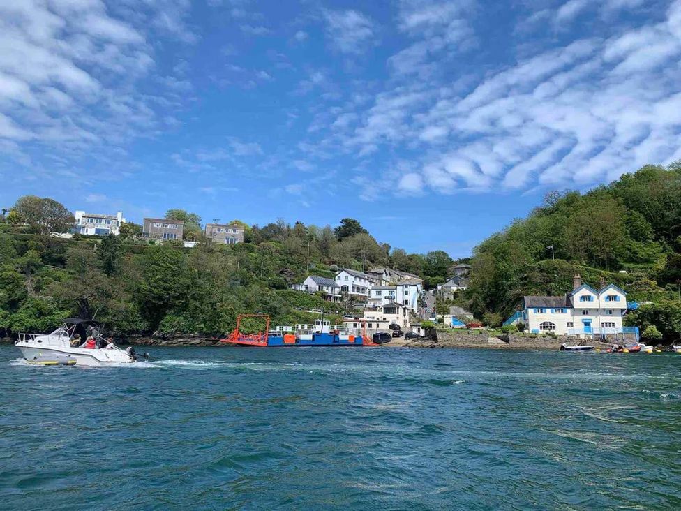 A view of boats and houses along the water at The Slipway Fowey Harbour with Garden in Fowey