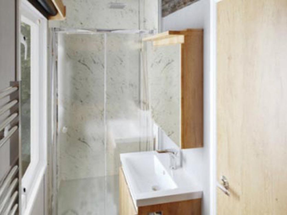 A bathroom with shower and sink at Selfcatering Lodge Inverness Sleeps 4