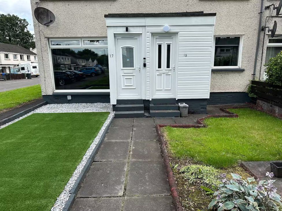 An outdoor entrance with two doors and a garden at Family Garden Parking WiFi Sleeps 5 in Alloa