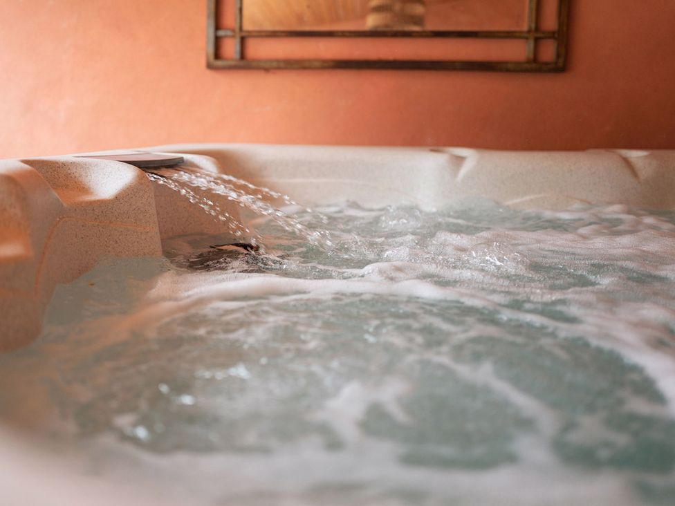 A hot tub with water flowing at North Norfolk Garden Retreat with Private Hot Tub Crossdale Street near Cromer