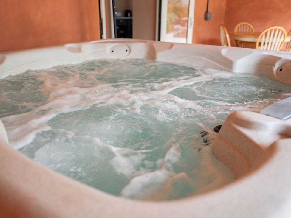 A hot tub with bubbling water at North Norfolk Garden Retreat with Private Hot Tub, Crossdale Street near Cromer