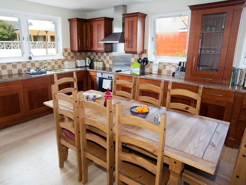 A kitchen with wooden table and chairs at the property in an indoor location