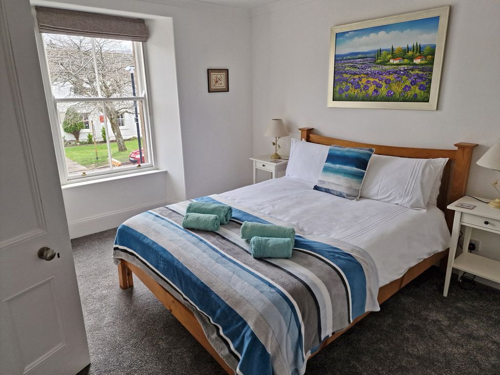 A bedroom with a bed and window at the property