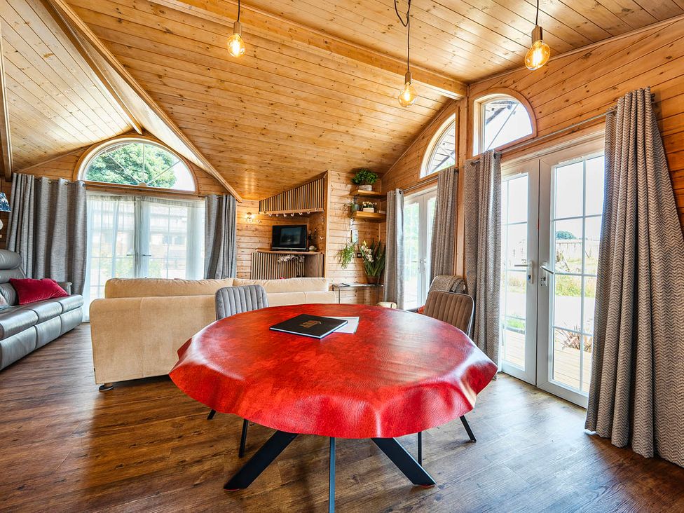 A living room with a dining table and sofa at Alpaca Farm Valley Views Sleeps 4 Parking Pets in Husthwaite