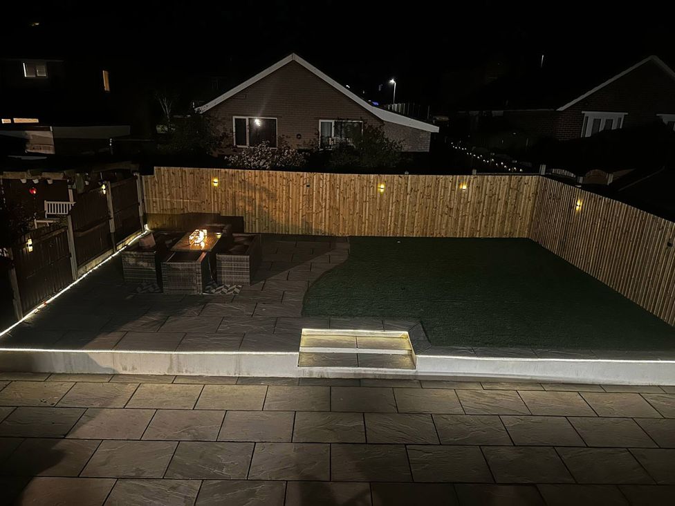 A garden with a patio area and seating at 3 Bed Sleeps 5 Garden Parking Pets in Carlisle