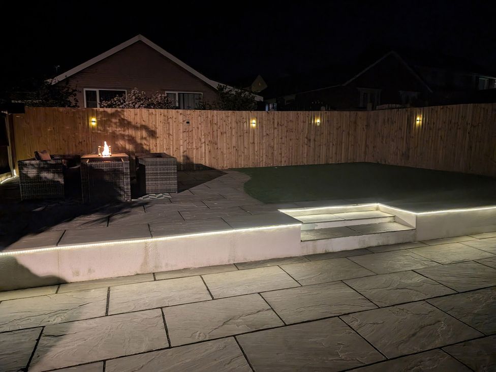 A garden with a seating area and outdoor lighting at 3 Bed Sleeps 5 Garden Parking Pets in Carlisle